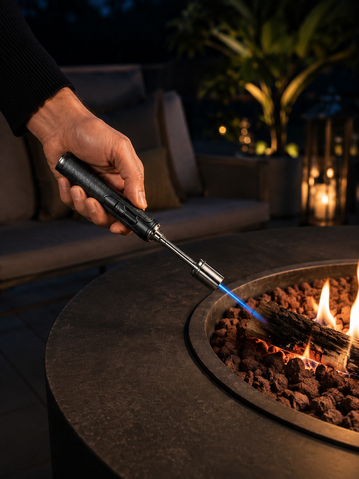 SG017 extended-reach torch used to ignite wood in a fire pit